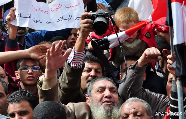 Egyptian protesters take part in a demonstration and Friday prayers in Tahrir Square, Cairo, Egypt, Friday, Feb. 25, 2011. Tens of thousands rallied in Cairo's Tahrir Square on Friday, trying to keep up pressure on Egypt...