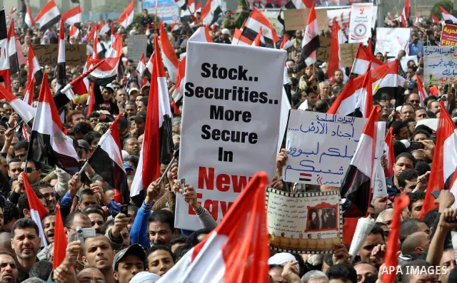 Egyptian protesters take part in a demonstration and Friday prayers in Tahrir Square, Cairo, Egypt, Friday, Feb. 25, 2011. Tens of thousands rallied in Cairo's Tahrir Square on Friday, trying to keep up pressure on Egypt...