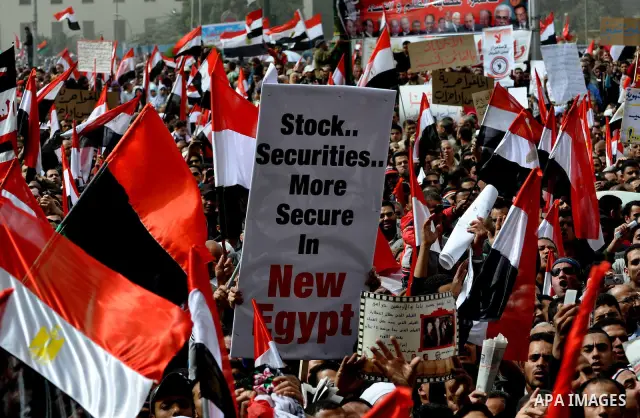 Egyptian protesters take part in a demonstration and Friday prayers in Tahrir Square, Cairo, Egypt, Friday, Feb. 25, 2011. Tens of thousands rallied in Cairo's Tahrir Square on Friday, trying to keep up pressure on Egypt...