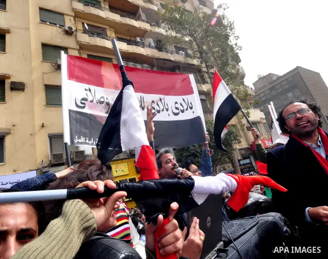 Egyptian protesters take part in a demonstration and Friday prayers in Tahrir Square, Cairo, Egypt, Friday, Feb. 25, 2011. Tens of thousands rallied in Cairo's Tahrir Square on Friday, trying to keep up pressure on Egypt...