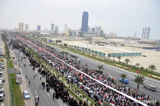 Protesters march on the streets of Manama, Bahrain, 25 February 2011. Tens of thousands of protesters marched in the Bahraini capital of Manama on 25 February to demand the resignation of the cabinet. It was the latest i...