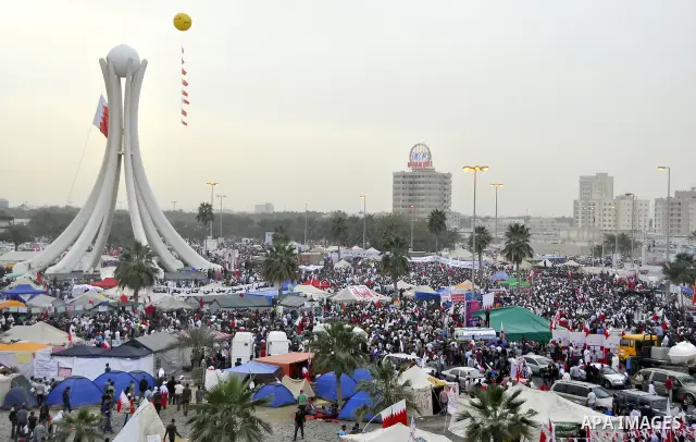 Protesters march on the streets of Manama, Bahrain, 25 February 2011. Tens of thousands of protesters marched in the Bahraini capital of Manama on 25 February to demand the resignation of the cabinet. It was the latest i...