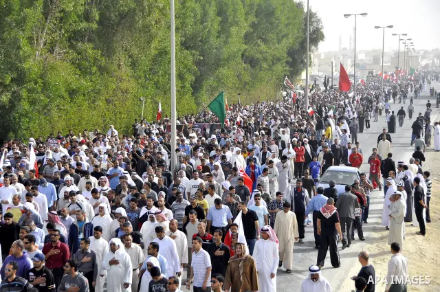 Anti-monarchy protesters and relatives accompany the coffin with the corpse of protester Abdul Redha Mohammed Hassan, 32, who was shot in the head by security forces while trying to march to Pearl Square, during the buri...