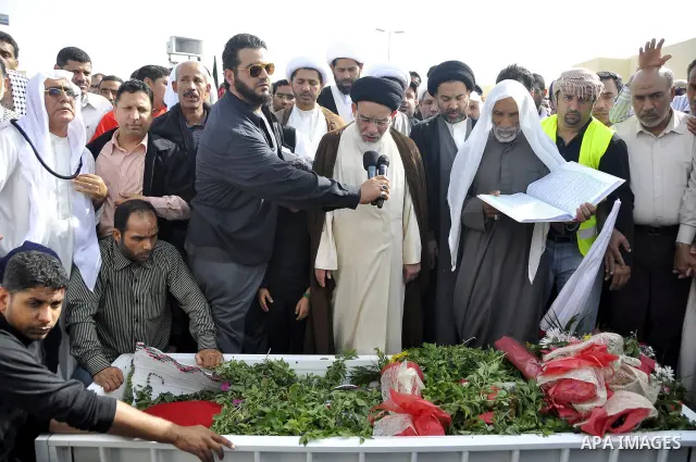 Anti-monarchy protesters and relatives accompany the coffin with the corpse of protester Abdul Redha Mohammed Hassan, 32, who was shot in the head by security forces while trying to march to Pearl Square, during the buri...