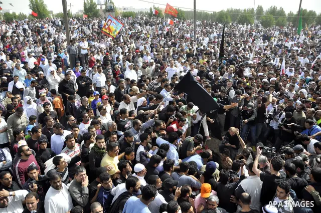 Anti-monarchy protesters and relatives accompany the coffin with the corpse of protester Abdul Redha Mohammed Hassan, 32, who was shot in the head by security forces while trying to march to Pearl Square, during the buri...