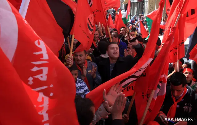Palestinian supporters of the Palestinian Peoples Party (PPP) shout slogans during a rally in the centre of the West Bank city of Nablus demanding an end to the split between the Gaza Strip and the West Bank and calling...