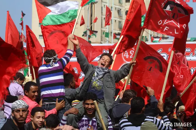 Palestinian supporters of the Democratic Front for the Liberation of Palestine (DFLP) shout slogans calling for the national unity during a rally marking the 42nd anniversary of the group's founding, in Gaza City, on Feb...