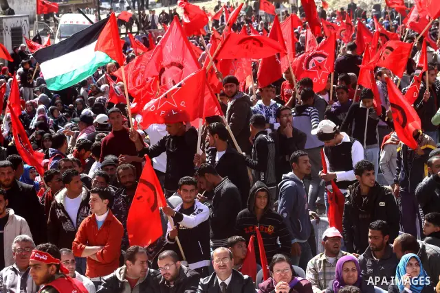 Palestinian supporters of the Democratic Front for the Liberation of Palestine (DFLP) carry flags during a rally celebrating 42 years since its founding in Gaza City, Saturday, Feb. 26, 2011. Founded in 1969 the DFLP is...