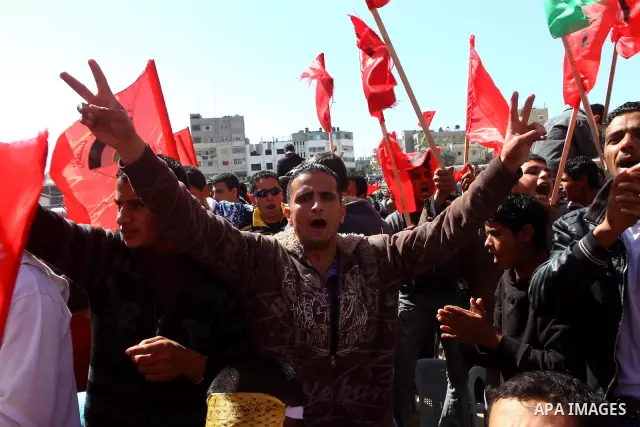 Palestinian supporters of the Democratic Front for the Liberation of Palestine call for the national unity during a rally marking the 42nd anniversary of the group's founding, in Gaza City, on Feb. 26, 2011. Photo by Ash...