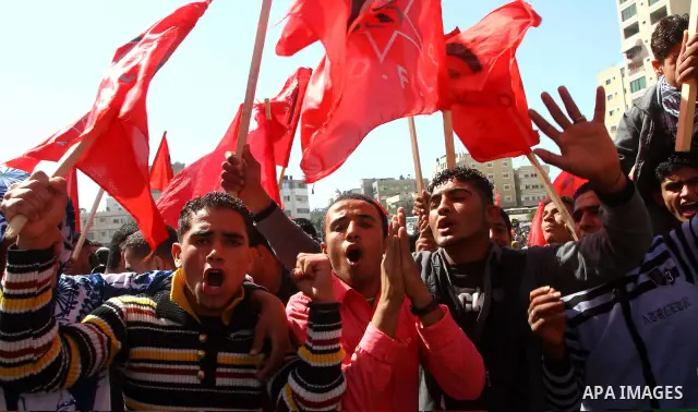 Palestinian supporters of the Democratic Front for the Liberation of Palestine (DFLP) shout slogans calling for the national unity during a rally marking the 42nd anniversary of the group's founding, in Gaza City, on Feb...