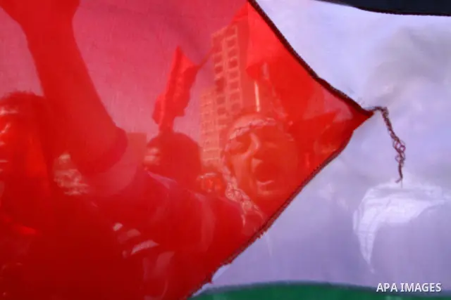 Palestinian supporters of the Democratic Front for the Liberation of Palestine (DFLP) shout slogans calling for the national unity during a rally marking the 42nd anniversary of the group's founding, in Gaza City, on Feb...