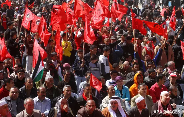 Palestinian supporters of the Democratic Front for the Liberation of Palestine (DFLP) carry flags during a rally celebrating 42 years since its founding in Gaza City, Saturday, Feb. 26, 2011. Founded in 1969 the DFLP is...