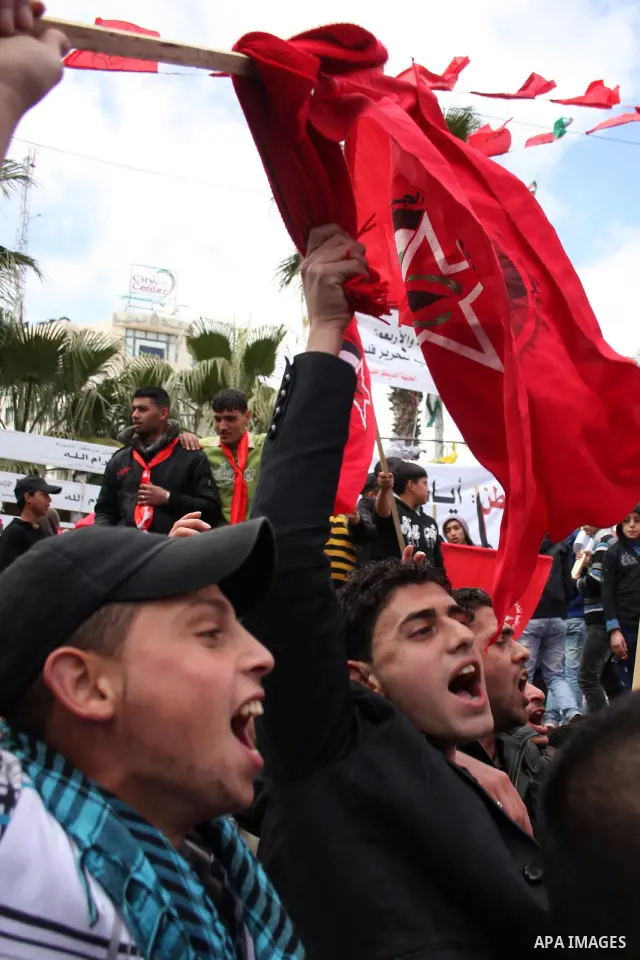 Palestinian supporters of the Democratic Front for the Liberation of Palestine (DFLP) carry flags during a rally celebrating 42 years since its founding in the West Bank city of Ramallah, Saturday, Feb. 26, 2011. Founded...