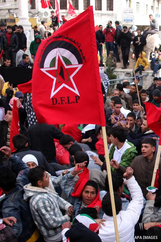 Palestinian supporters of the Democratic Front for the Liberation of Palestine (DFLP) carry flags during a rally celebrating 42 years since its founding in the West Bank city of Ramallah, Saturday, Feb. 26, 2011. Founded...