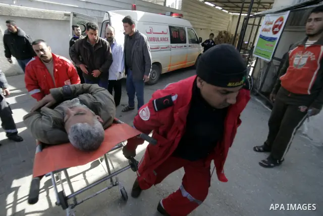 A Palestinian man is wheeled to the hospital after he was wounded in Israeli air raid, in the southern Gaza Strip town of Rafah, on Feb. 26, 2011. Israeli aircraft attacked two military sites of the armed wing of the Isl...