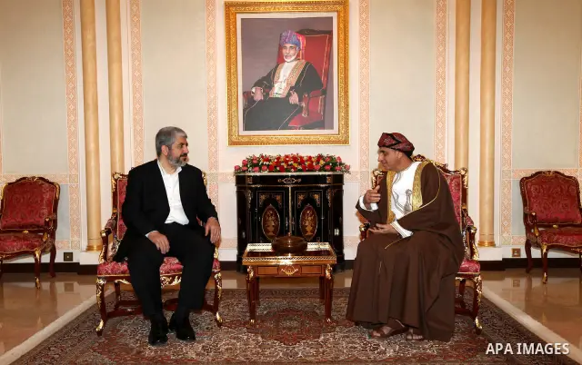 Palestinian Hamas leader Khaled Meshaal, (L), during a meeting the deputy prime minister of the Sultanate of Oman, Fahd bin Mahmoud al Said, (R), in Sultanate of Oman on Feb. 26, 2011. Photo by Majd Majd