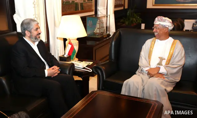 Palestinian Hamas leader Khaled Meshaal, (L), during a meeting with the Cultural Affairs Advisor to the Sultan, Abdul Aziz Bin Mohammed Al-Rawas, (R), in Sultanate of Oman on Feb. 26, 2011. Photo by Majd Majd