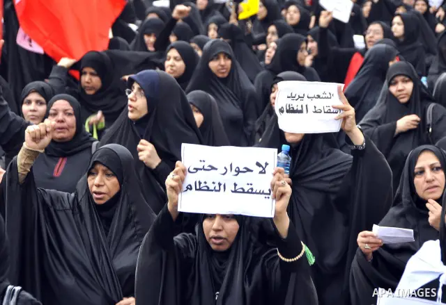 Bahraini Shiite anti-government protesters demonstrate in the streets of Manama on February 27, 2011. Eighteen Bahraini MPs from Al-Wefaq Shiite opposition bloc officially submitted their letter of resignation to protest...