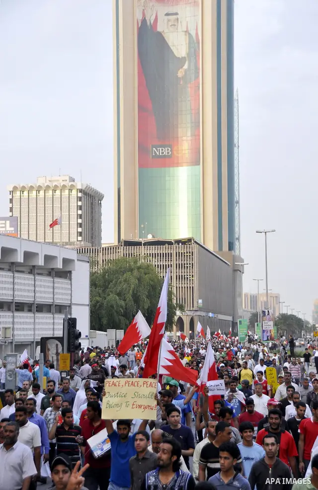 Bahraini Shiite anti-government protesters demonstrate in the streets of Manama on February 27, 2011. Eighteen Bahraini MPs from Al-Wefaq Shiite opposition bloc officially submitted their letter of resignation to protest...
