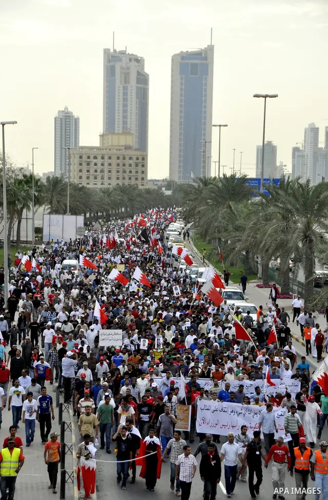 Bahraini Shiite anti-government protesters demonstrate in the streets of Manama on February 27, 2011. Eighteen Bahraini MPs from Al-Wefaq Shiite opposition bloc officially submitted their letter of resignation to protest...