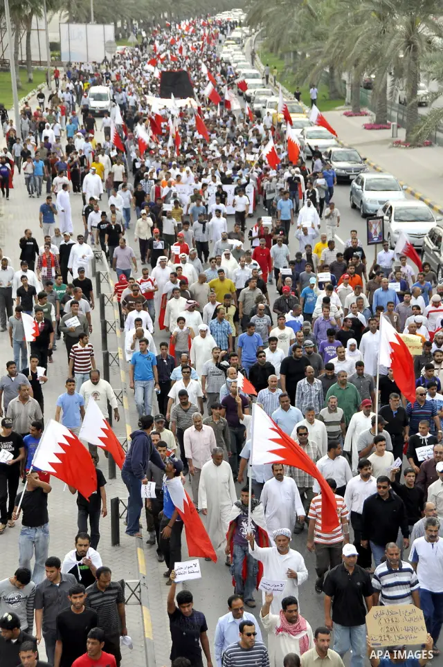 Bahraini Shiite anti-government protesters demonstrate in the streets of Manama on February 27, 2011. Eighteen Bahraini MPs from Al-Wefaq Shiite opposition bloc officially submitted their letter of resignation to protest...