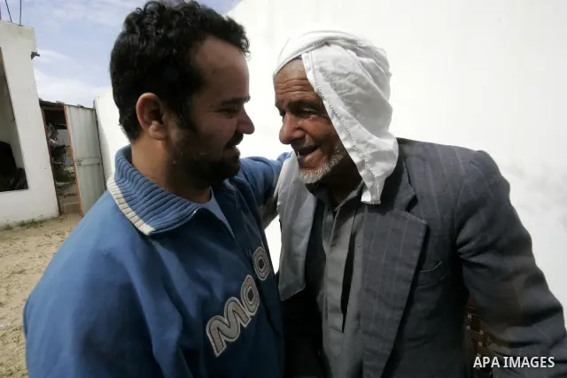 Palestinian prisoner Nabil Mansour al-Bashiti, 49 years, is welcomed by relatives after his arrival to his home in Khan Younis in the southern Gaza Strip on March 01, 2011. Egyptian authorities released al-Bashiti after...