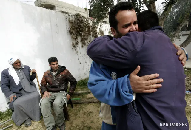 Palestinian prisoner Nabil Mansour al-Bashiti, 49 years, is welcomed by relatives after his arrival to his home in Khan Younis in the southern Gaza Strip on March 01, 2011. Egyptian authorities released al-Bashiti after...