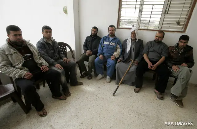 Palestinian prisoner Nabil Mansour al-Bashiti, 49 years, is welcomed by relatives after his arrival to his home in Khan Younis in the southern Gaza Strip on March 01, 2011. Egyptian authorities released al-Bashiti after...