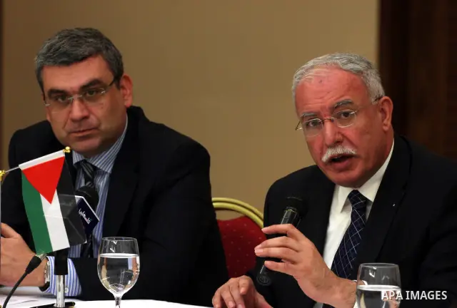 Palestinian Foreign Minister, Riyad al-Malki and the Romanian Foreign Minister, Teodor Baconschi attend a meeting in the West Bank city of Ramallah on March 1, 2011. Photo by Issam Rimawi