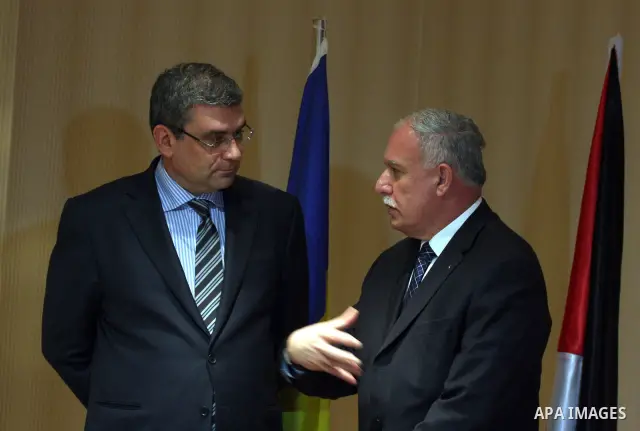 Palestinian Foreign Minister, Riyad al-Malki and the Romanian Foreign Minister, Teodor Baconschi deliver speech during a press conference in the West Bank city of Ramallah on March 1, 2011. Photo by Issam Rimawi