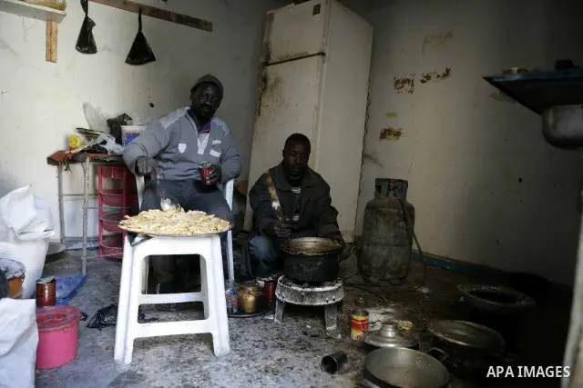 African migrant workers living in miserable conditions in Benghazi March 1, 2011. African workers fear attacks from Libyans hunting for alleged mercenary fighters. Wealthier Western and Asian states have sent ships to ev...