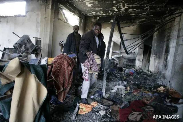 African migrant workers living in miserable conditions in Benghazi March 1, 2011. African workers fear attacks from Libyans hunting for alleged mercenary fighters. Wealthier Western and Asian states have sent ships to ev...
