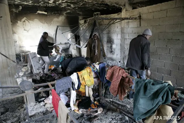 African migrant workers living in miserable conditions in Benghazi March 1, 2011. African workers fear attacks from Libyans hunting for alleged mercenary fighters. Wealthier Western and Asian states have sent ships to ev...