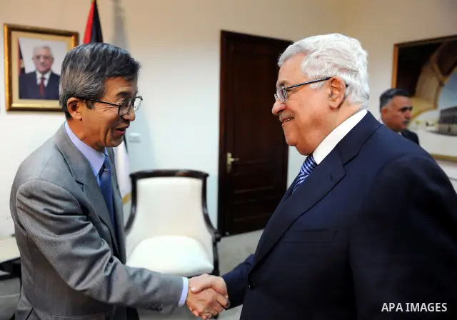 Palestinian President Mahmoud Abbas (Abu Mazen) meets with Japan's envoy to the peace process in the Middle East, Yutaka Imura in the West Bank city of Ramallah on March 1, 2011. Photo by Omar Rashidi