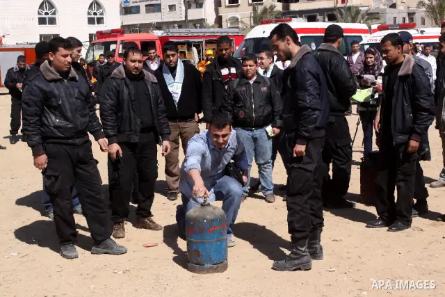 Palestinian civil defense members stage a mock rescue operation during a training exercise marking the International Civil Defense Day in Gaza city on March 2,2011 . Photo by Mohammed Asad
