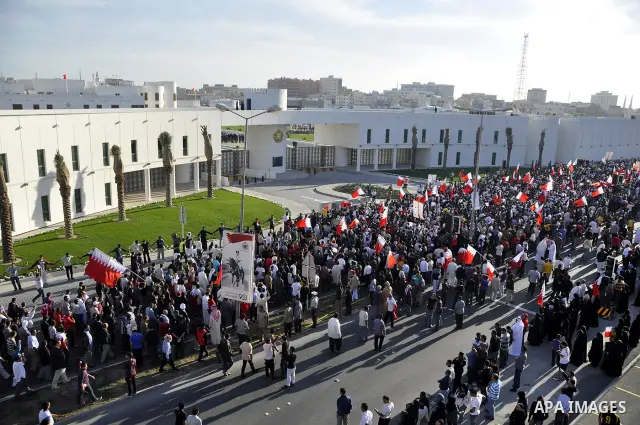 Protesters demonstrate in front of the Interior Ministry in Manama, capital of Bahrain, March 2, 2011. Anti-government protesters turned up in hundreds here on Wednesday, calling for the release of remaining political pr...