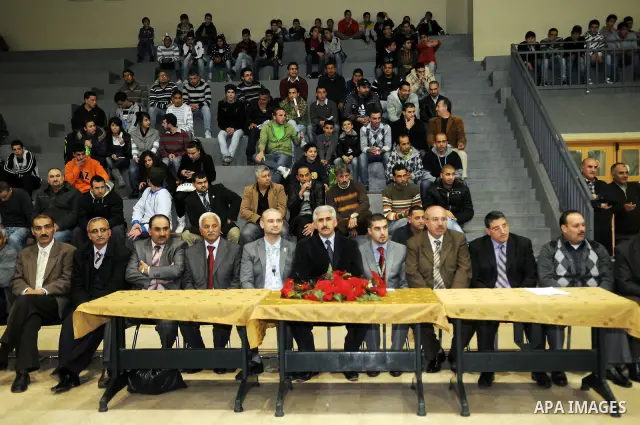 Palestinians attend a match between Abdaa team and Alfaraa team during opening of Premier League for basketball, in the West Bank City of Bethlehem on March 02, 2011. Photo by Najeh Hashlamoun