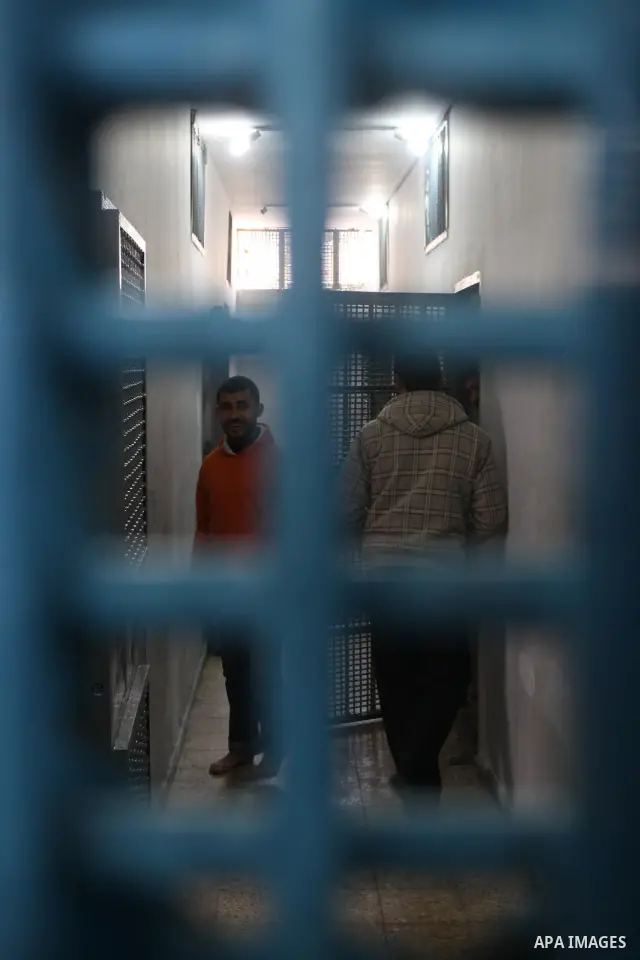 Palestinian prisoners are seen at the new department for prisoners at a police station during the opening ceremony, in Gaza City on March 3, 2011. Photo by Mohammed Asad