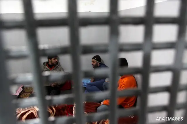 Palestinian prisoners are seen at the new department for prisoners at a police station during the opening ceremony, in Gaza City on March 3, 2011. Photo by Mohammed Asad