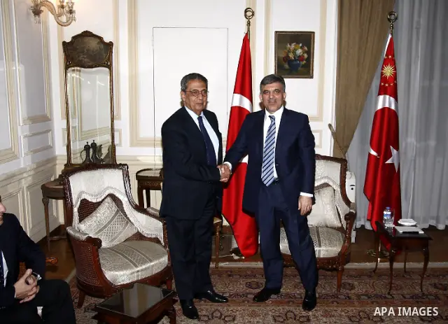 Turkish President Abdullah Gul, right, shakes hands with Amr Moussa, secretary general of the Arab League, during their meeting in Cairo, Egypt, Thursday, March 3, 2011. Talks expected to focus on the aftermath of 18-day...