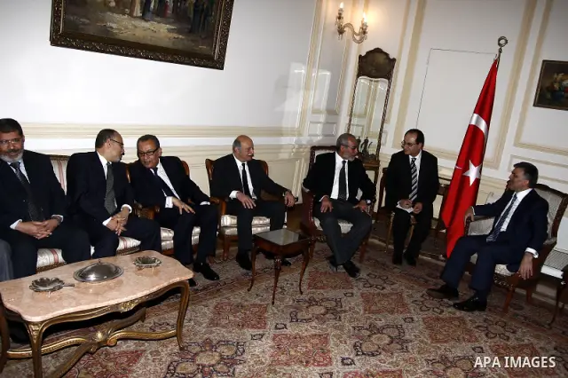 Turkish President Abdullah Gul, right, meets with Muslim Brotherhood leader Mohammed Badie in Cairo, Egypt, Thursday, March 3, 2011. Photo by Ahmed Asad
