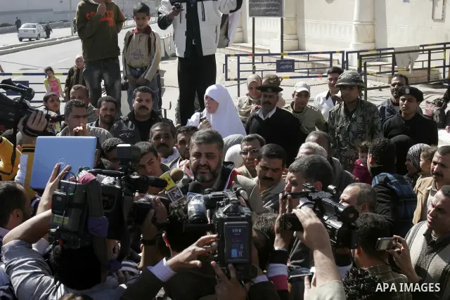 Khayrat el-Shater, the lead strategist for Egypt's largest opposition group, speaks to media after being released outside Tora prison in Cairo, Egypt, Thursday, March 3, 2011. Egypt's state news agency says two leading m...