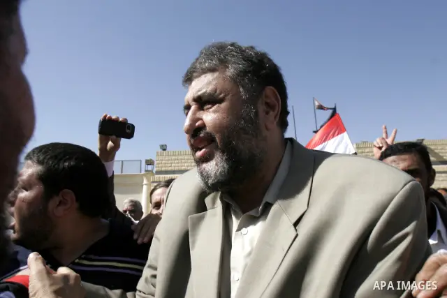 Khayrat el-Shater, the lead strategist for Egypt's largest opposition group, speaks to media after being released outside Tora prison in Cairo, Egypt, Thursday, March 3, 2011. Egypt's state news agency says two leading m...