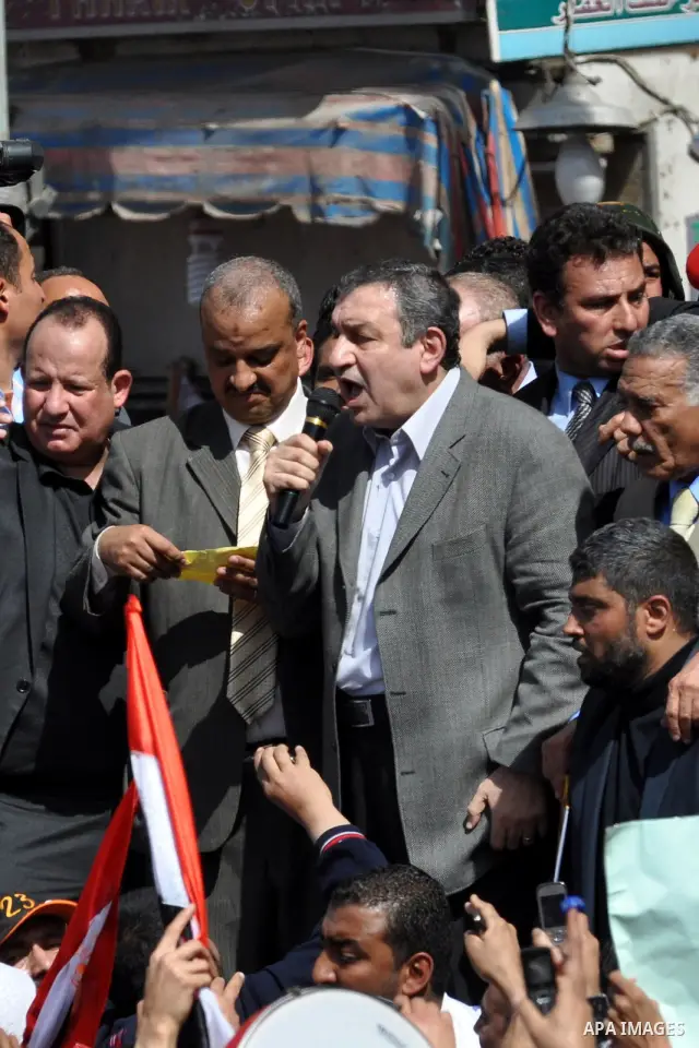 Egyptian Prime Minister designate Essam Sharaf, holding the microphone, speaks to demonstrators at Tahrir Square in Cairo, Egypt, Friday, March 4, 2011. Egypt's new prime minister designate has vowed before thousands of...