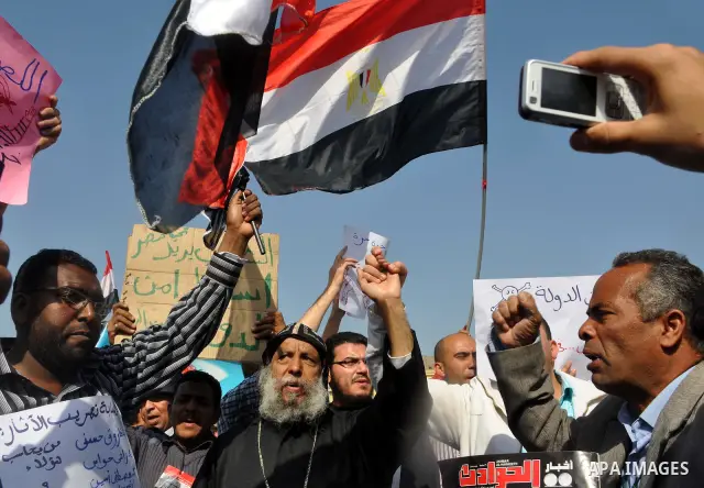 Demonstrators take part in a protest at Tahrir Square in Cairo, Egypt, Friday, March 4, 2011. Egypt's new prime minister designate has vowed before thousands of mostly young demonstrators at a central Cairo square that h...