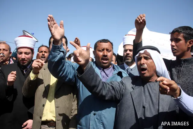 Palestinian take part during demonstration against the decision from Israeli authorities to demolish the mosque ,school and against Israel's controversial separation barrier and calling for the national reconciliation in...
