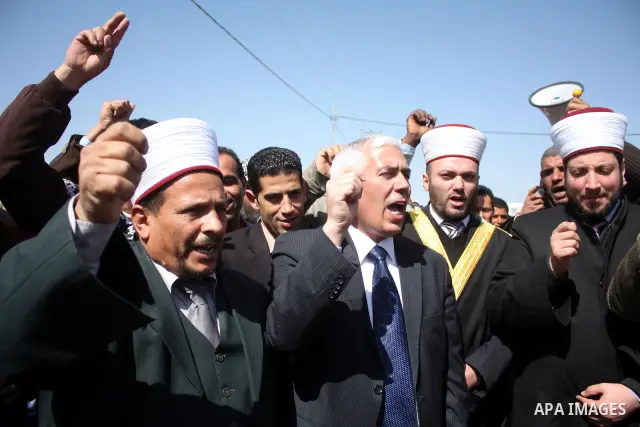 Palestinian take part during demonstration against the decision from Israeli authorities to demolish the mosque ,school and against Israel's controversial separation barrier and calling for the national reconciliation in...