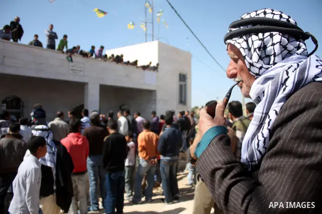 Palestinian take part during demonstration against the decision from Israeli authorities to demolish the mosque ,school and against Israel's controversial separation barrier and calling for the national reconciliation in...