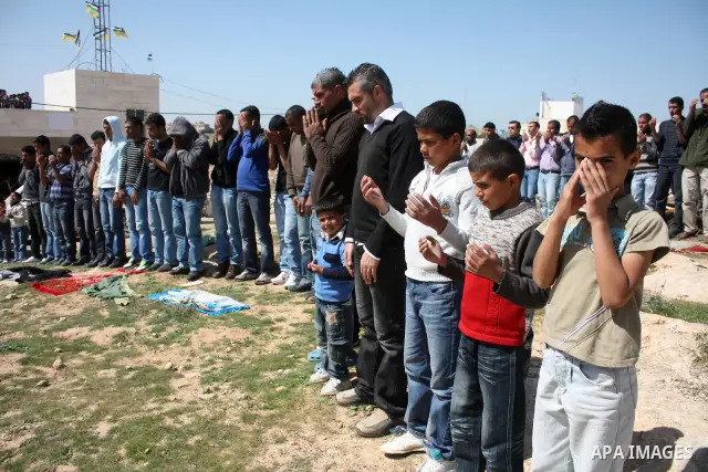 Palestinian take part during demonstration against the decision from Israeli authorities to demolish the mosque ,school and against Israel's controversial separation barrier and calling for the national reconciliation in...