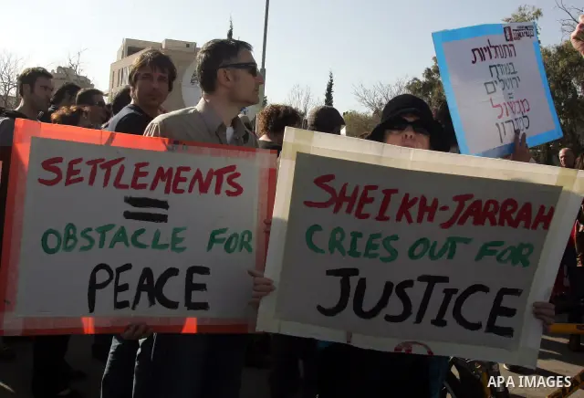 Palestinians and Israeli left-wing activists participate in a demonstration supporting Palestinians evicted from their homes in the east Jerusalem neighborhood of Sheikh Jarrah, Friday, March 4, 2011. Photo by Mahfouz Ab...